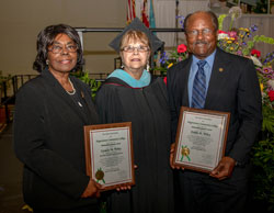 Wiley's holding award plaques