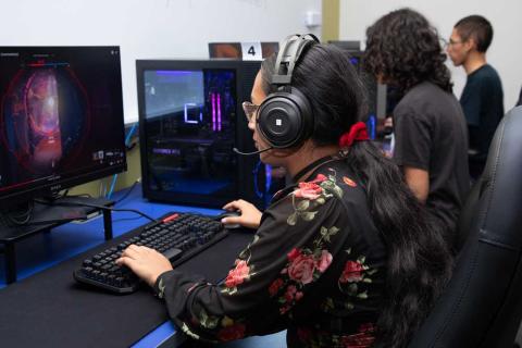 Students sitting at the gaming stations in the HCC Esports Center
