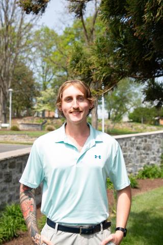 Joseph Clark smiling on campus